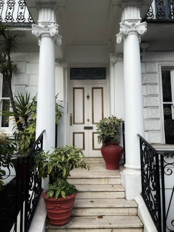 A custom column design in black and silver standing proudly at the entrance of a modern home.