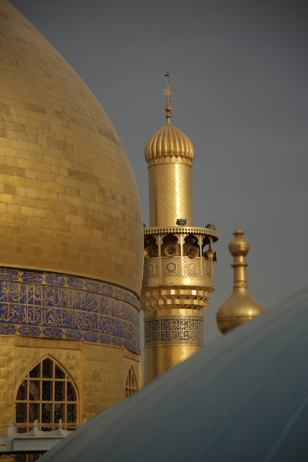 a large golden dome with a cross on top of it