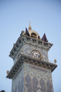 A close-up of a vibrant mosque prayer clock with colorful running text display.