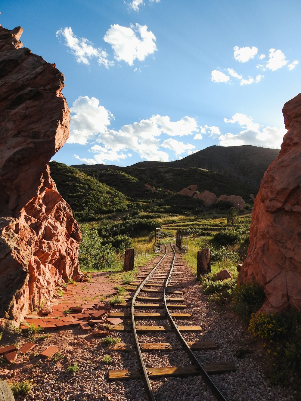 a train track going through a rocky landscape