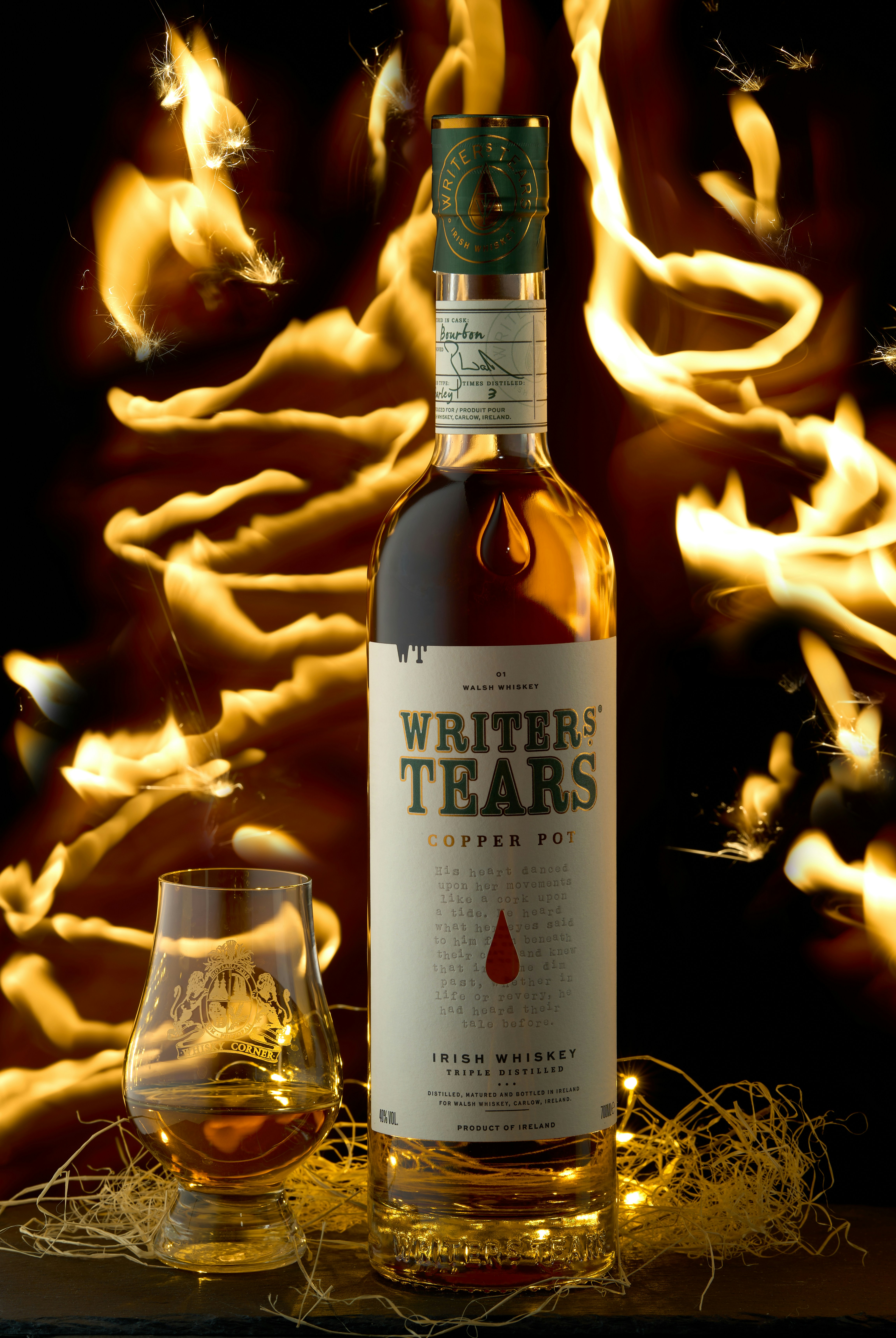 a bottle of wine sitting next to a glass