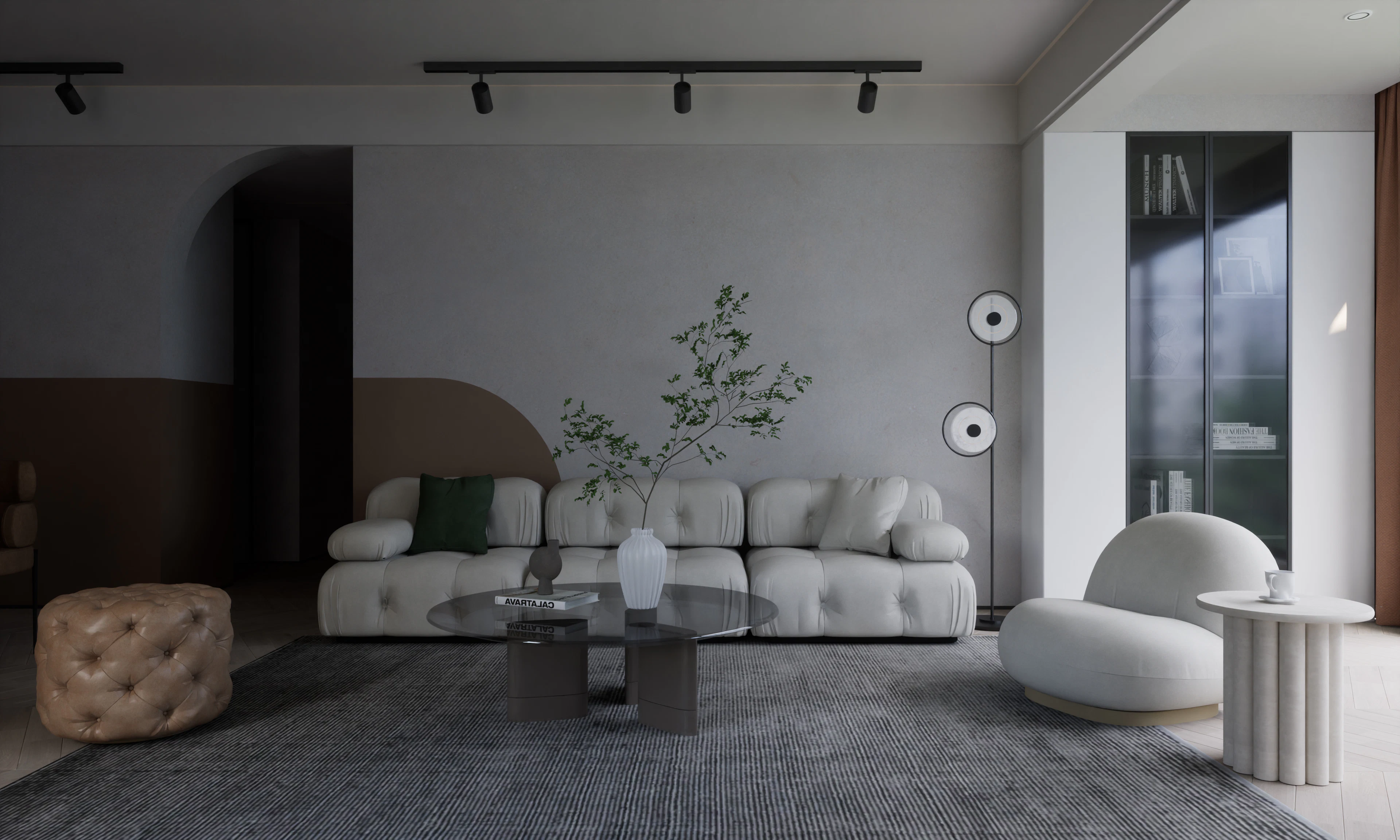 A compact grey living room with a modular sofa and track lighting