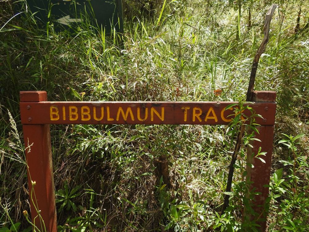 a sign that is in the middle of a field