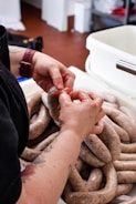 A sausage stuffer machine being operated.