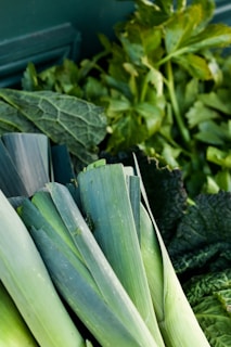 A variety of leafy greens including lettuce, spinach, and kale.