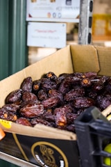 a cardboard box filled with raisins sitting on top of a table