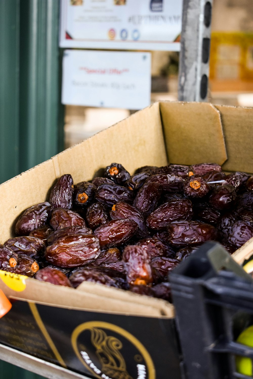 a cardboard box filled with raisins sitting on top of a table