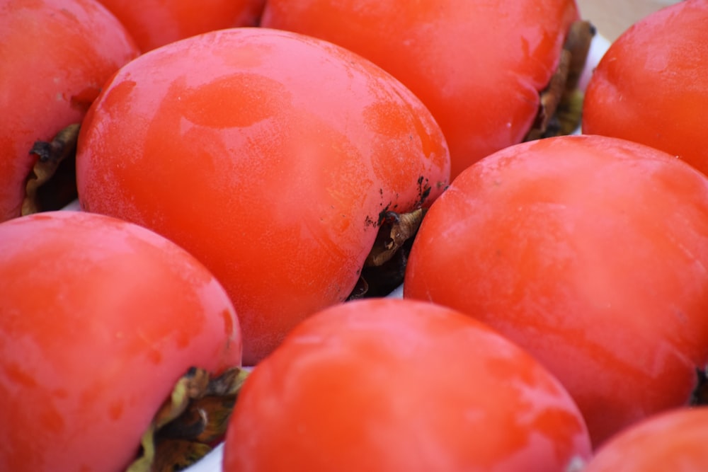 a close up of a bunch of tomatoes