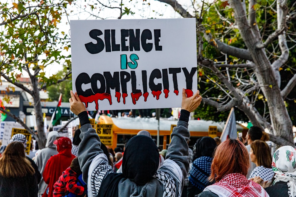 a group of people holding up a sign