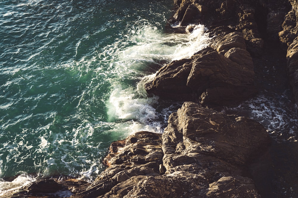 a view of the ocean from a rocky cliff