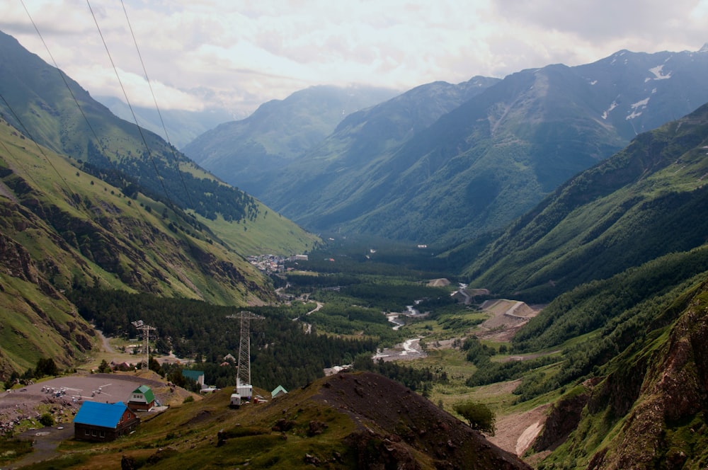 a view of a valley with mountains in the background