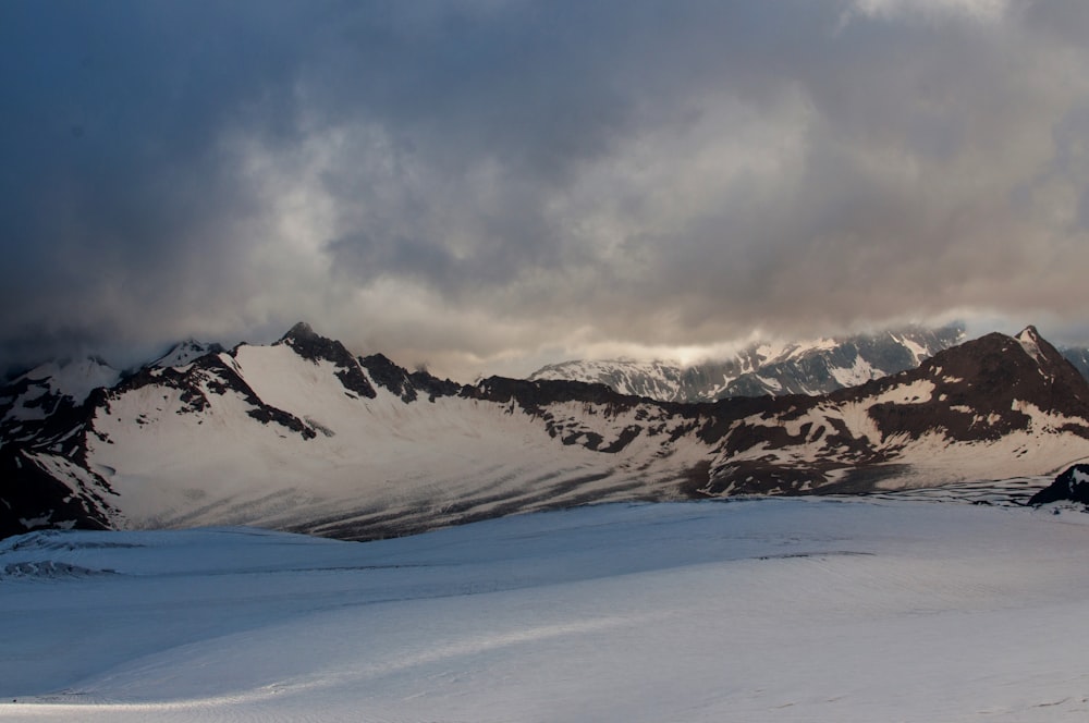 a man riding skis on top of a snow covered slope