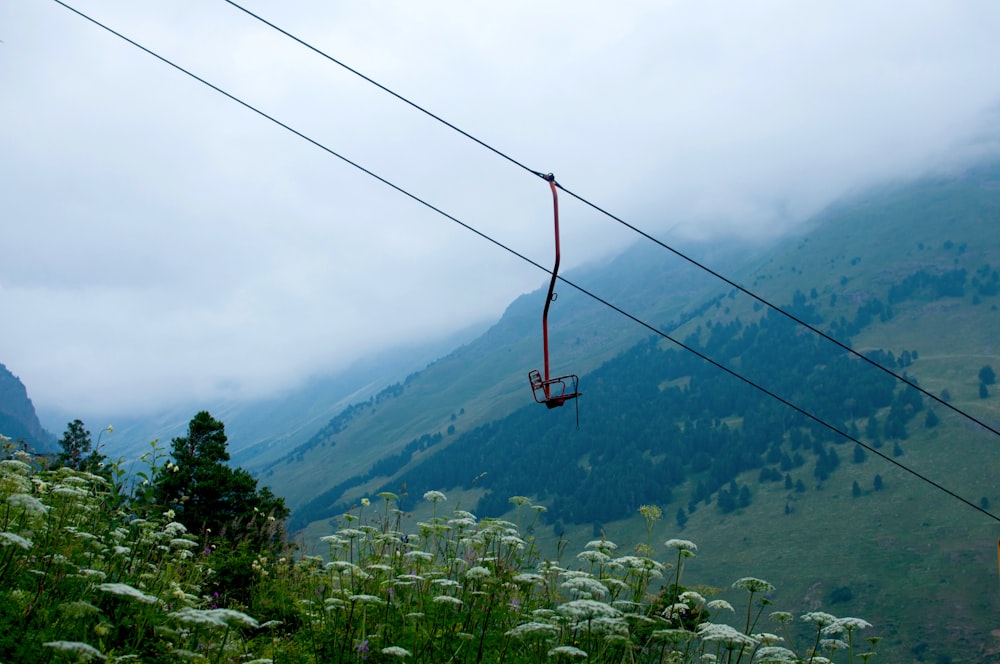 a view of a mountain range with a cable car in the foreground