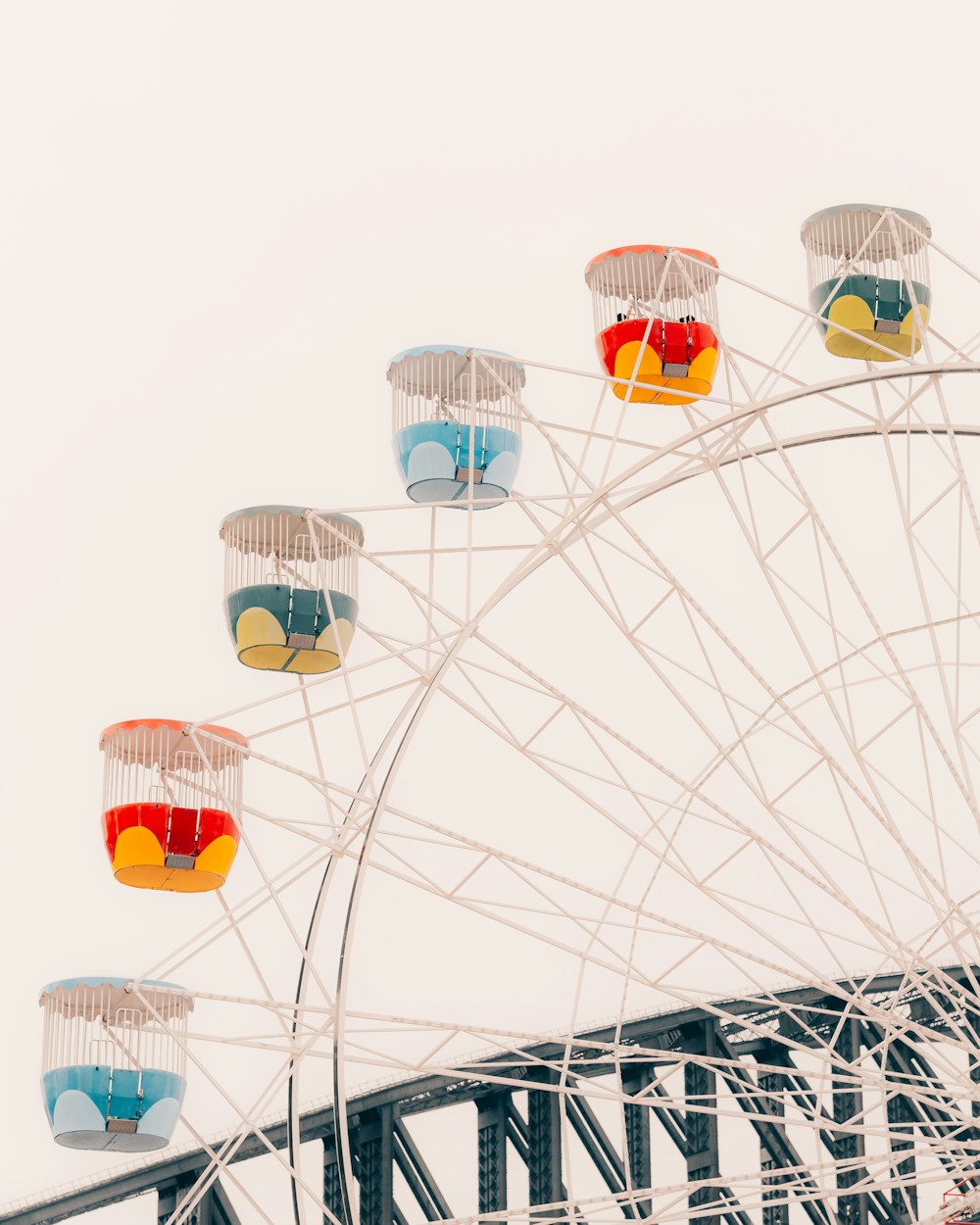 a ferris wheel with colorful glasses on top of it
