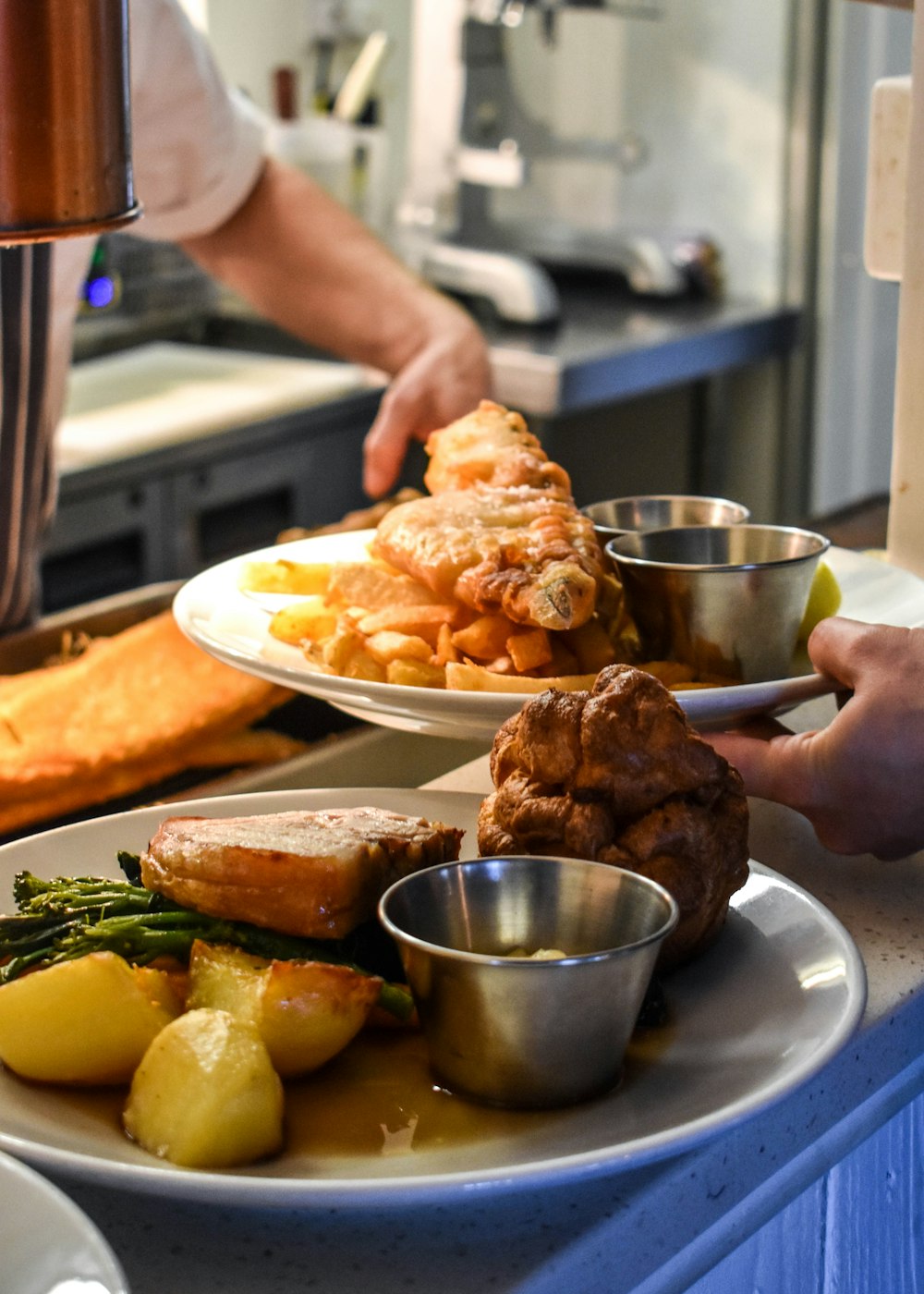 two plates of food on a counter in a kitchen