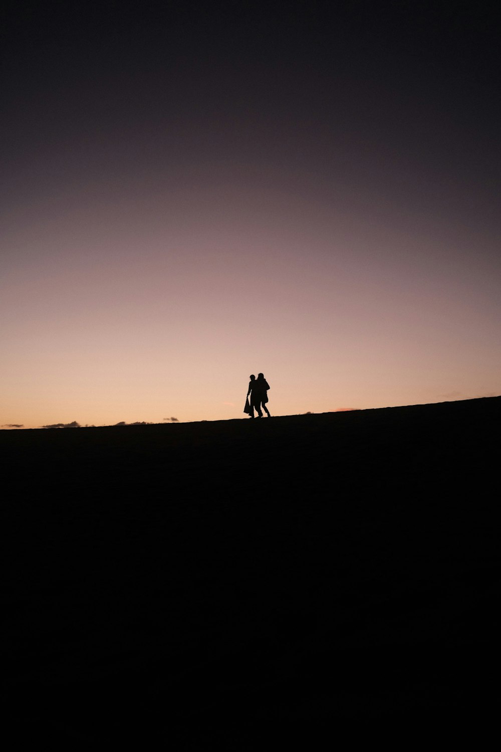 a couple of people that are standing in the dirt