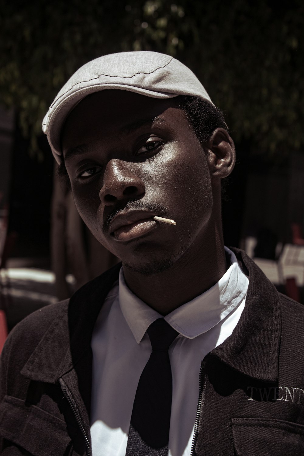 a man with a cigarette in his mouth