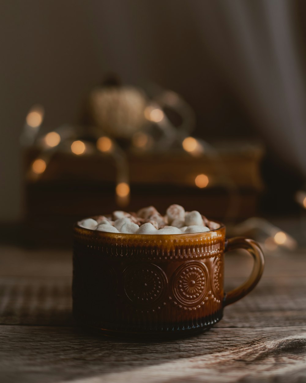 a cup of hot chocolate with marshmallows in it