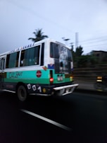 Stayway on a Latin American tour bus, with posters and gear scattered around, capturing the road trip vibe.