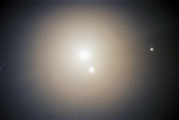 A serene image of a kundali chart glowing softly on a digital tablet screen.