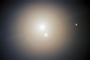 Soft glowing orbs floating gently against a dark starry background, representing healing energy.