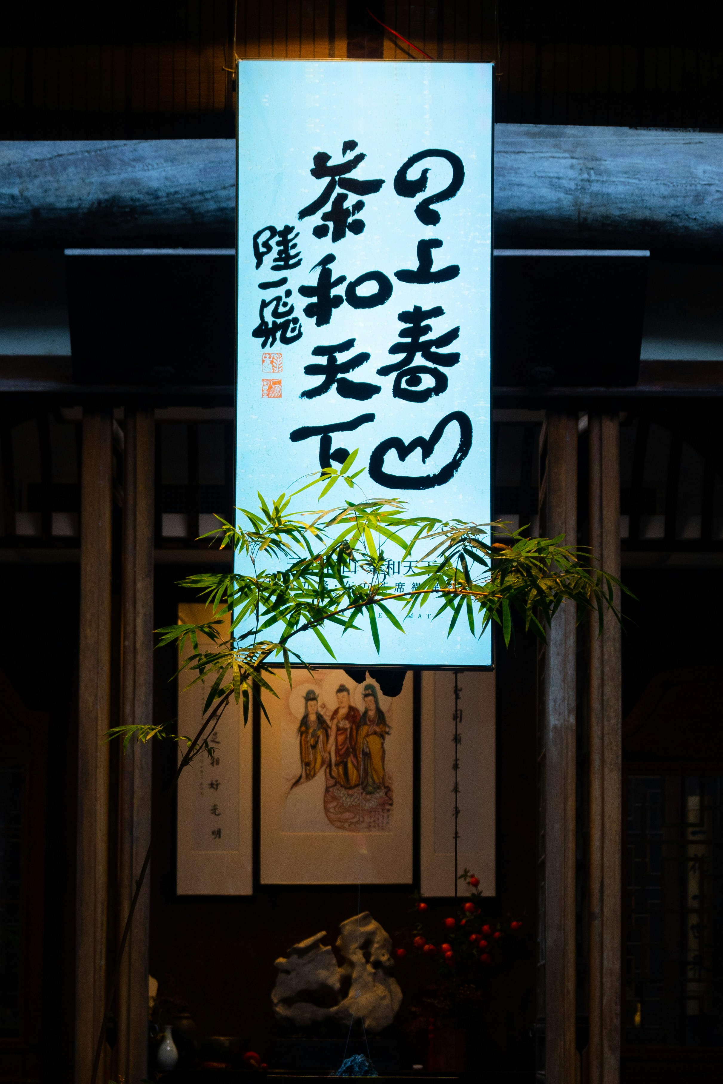 a sign hanging from the side of a building