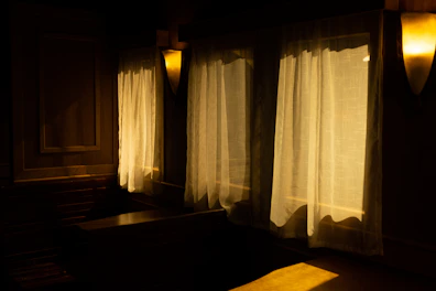Soft ambient lighting highlighting the warm tones of the comfort room.