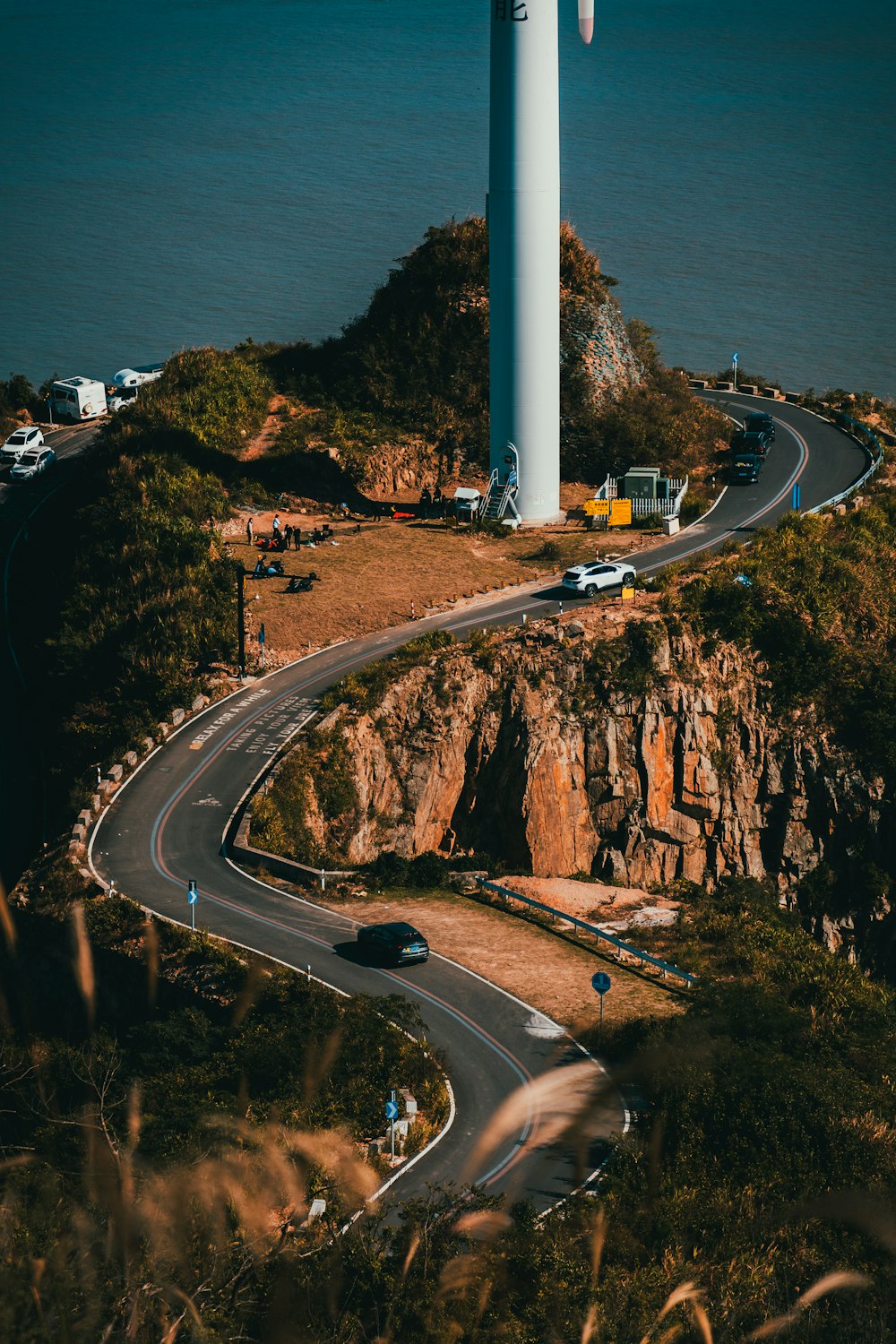 a very tall tower sitting on the side of a road