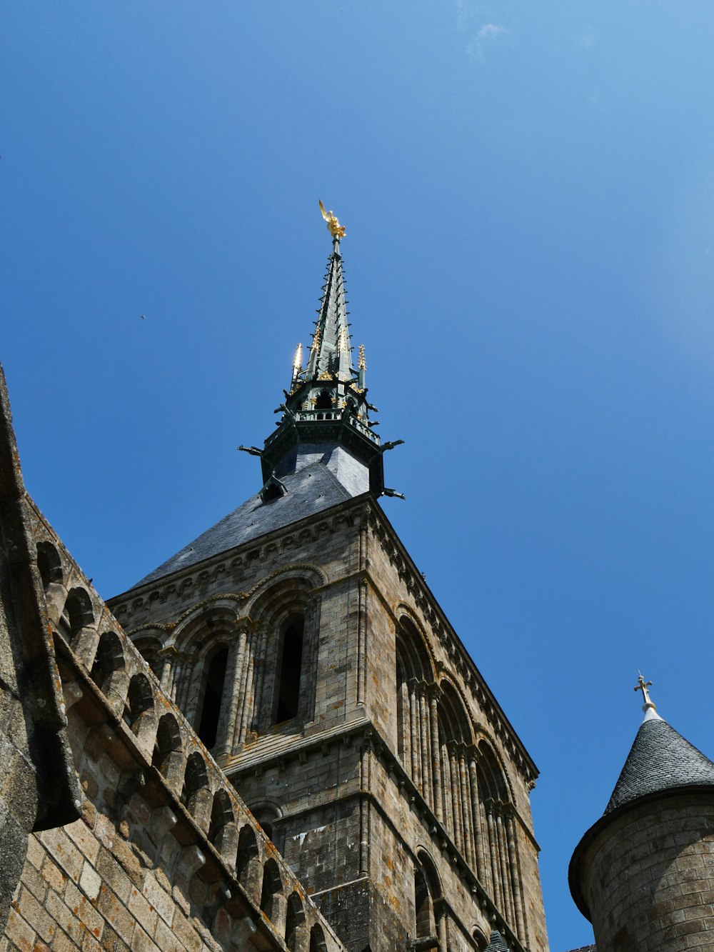 a tall tower with a clock on top of it