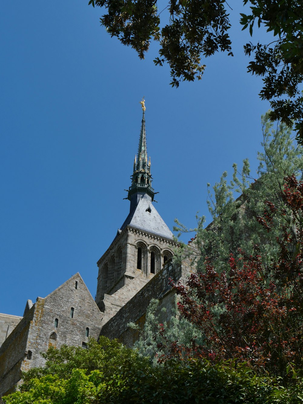 a tall building with a steeple on top of it