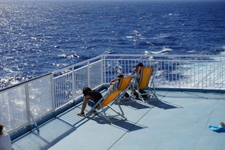 a couple of people that are sitting on some chairs