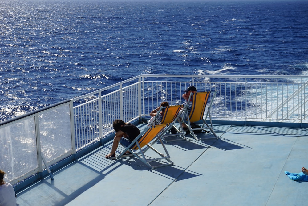 a couple of people that are sitting on some chairs