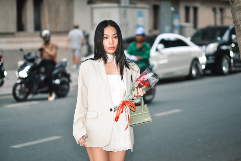 Elegant lady in white with bouquet
