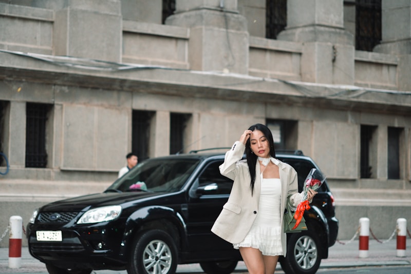 High-fashion woman in white dress walking