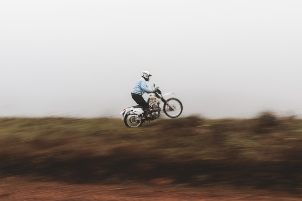 a person on a dirt bike in the air