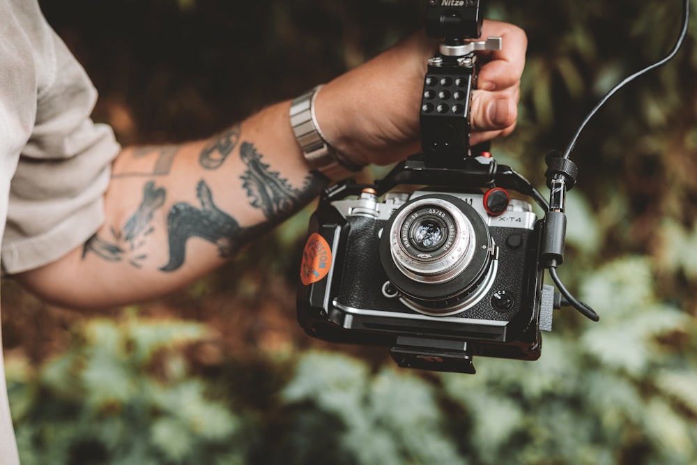 a man holding a camera in his hand