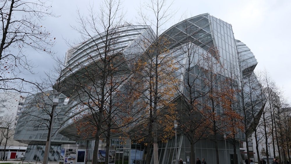 a building that has a lot of trees in front of it