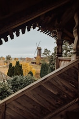 a view of a windmill from inside a building