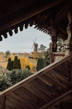 a view of a windmill from inside a building