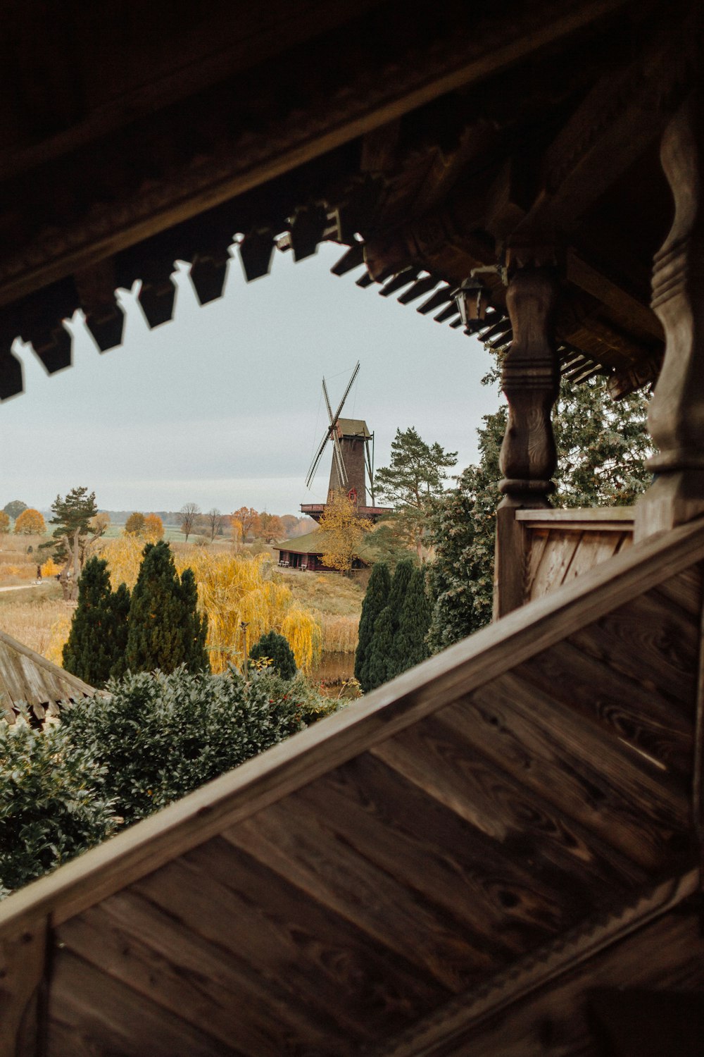 a view of a windmill from inside a building