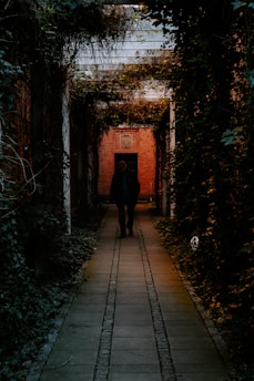 a couple of people that are walking down a walkway