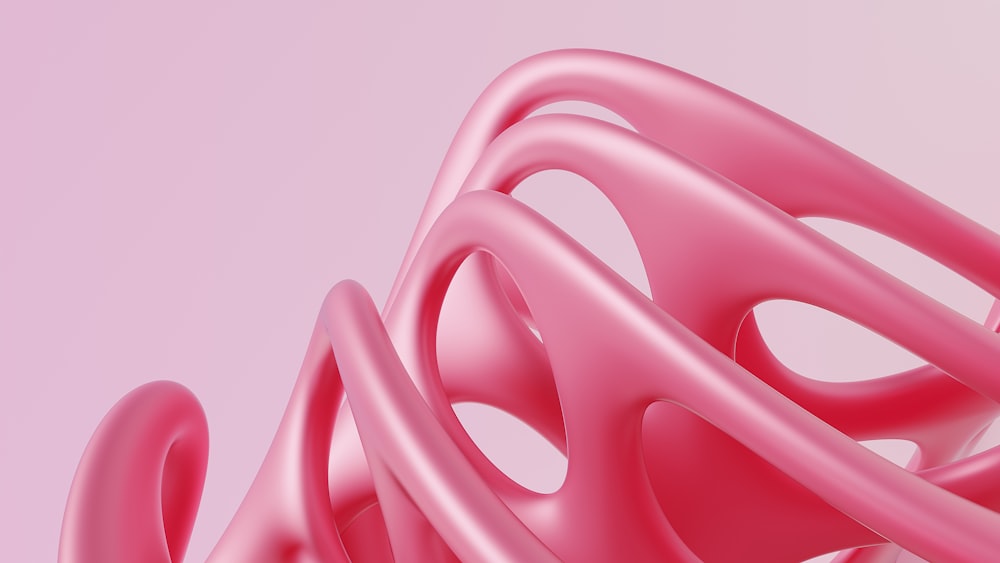 a close up of a pink object on a pink background