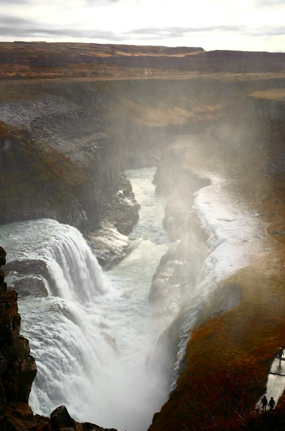 a waterfall in a large body of water