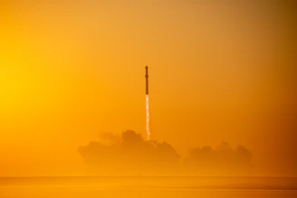 A vibrant graphic showing a rocket launching with bright sparks around it.