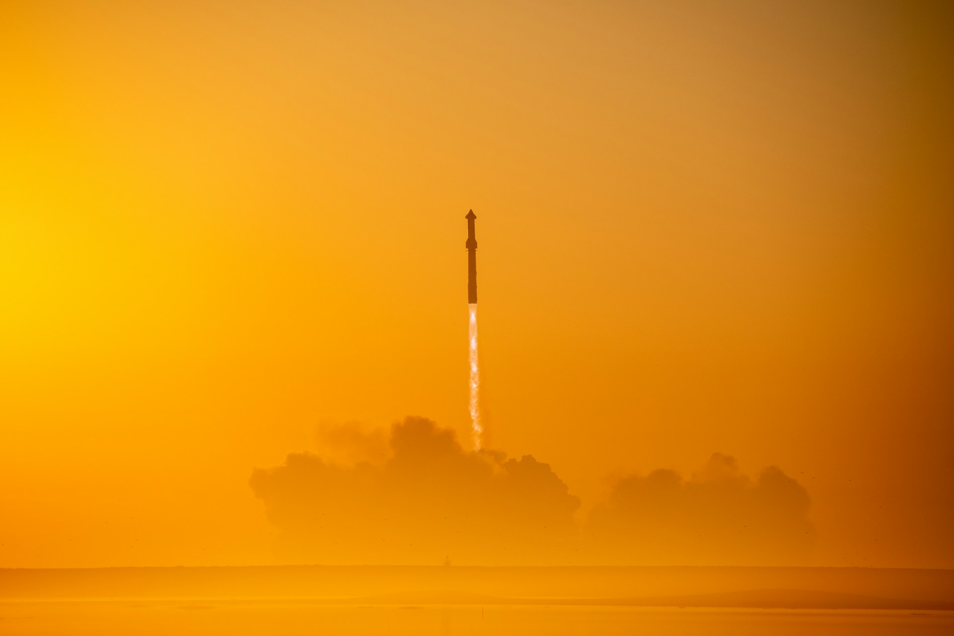 An exhilarating close-up of a rocket's engines igniting, with flames and smoke billowing dramatically.