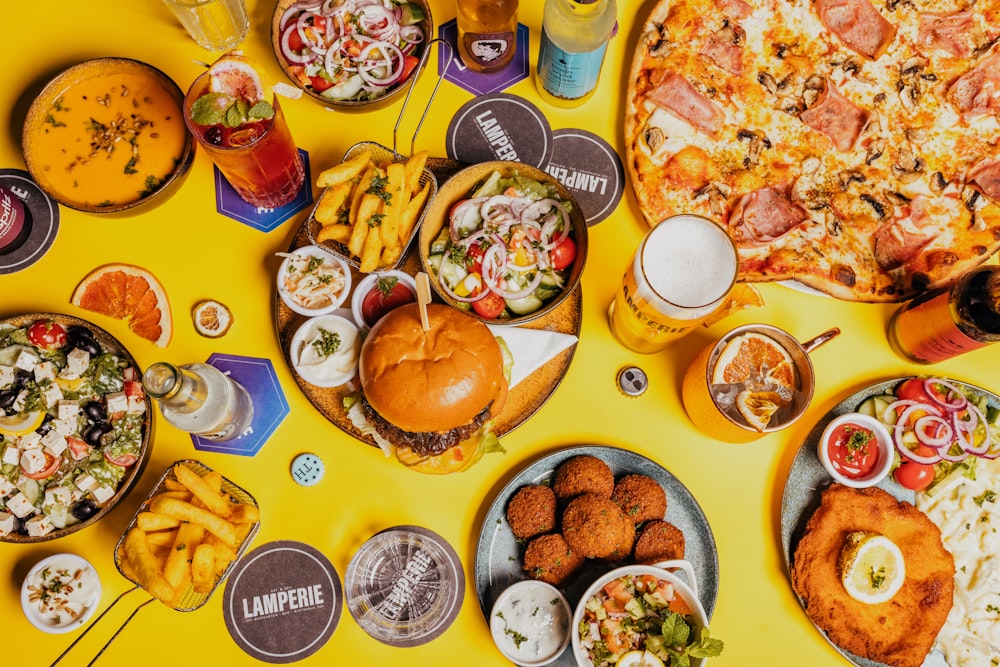 a table topped with lots of food and drinks