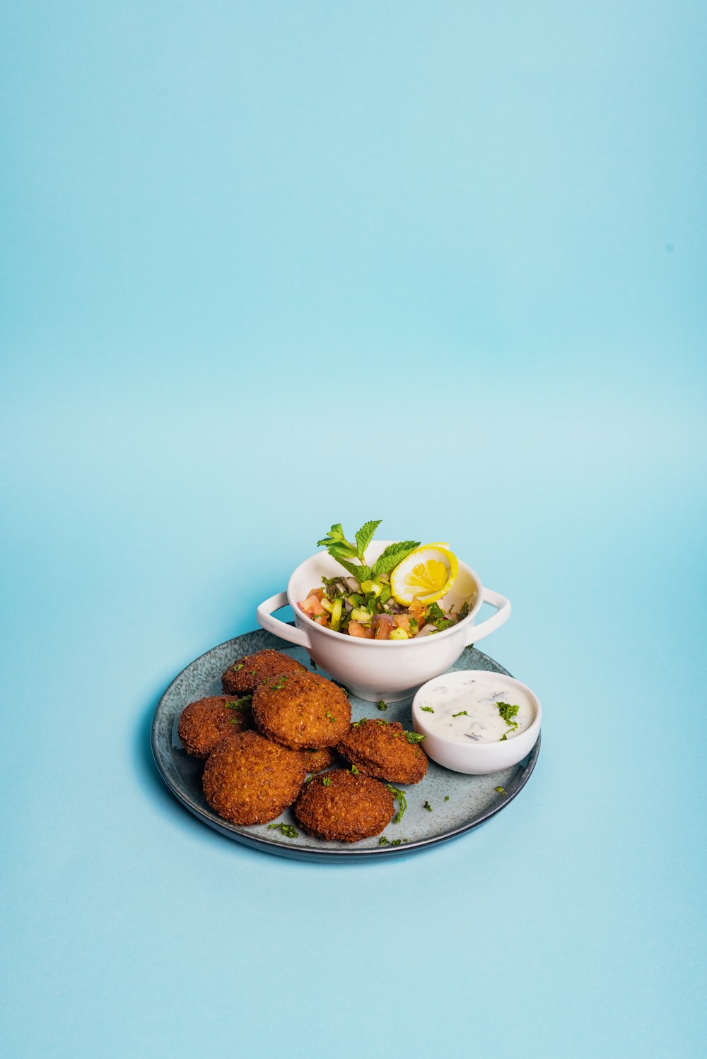 a plate of food on a blue background