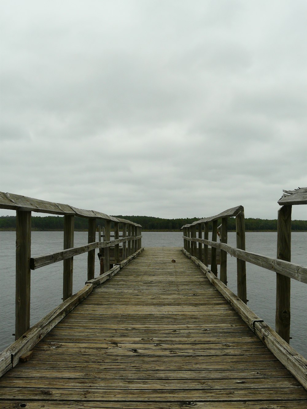 a wooden bridge over a body of water