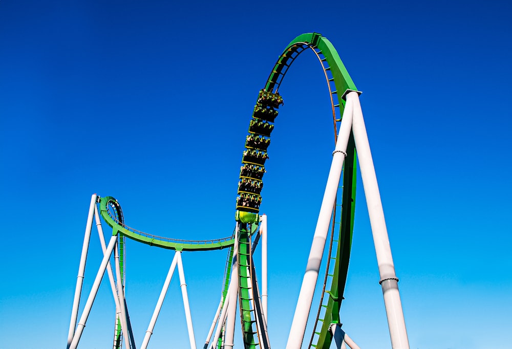 a roller coaster in the middle of a blue sky