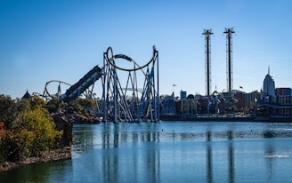 a roller coaster in the middle of a body of water